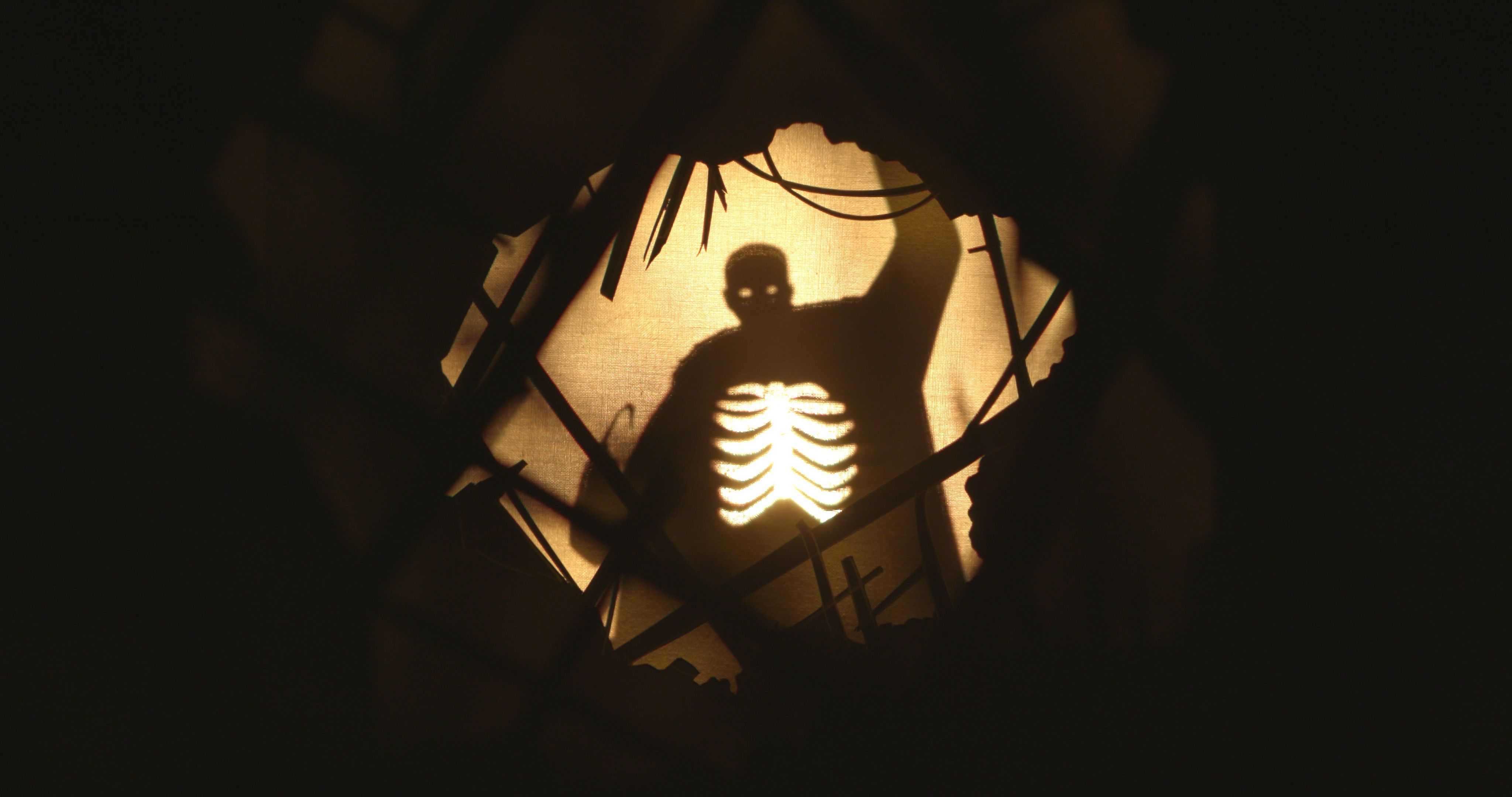 A shadow man holding a hook
