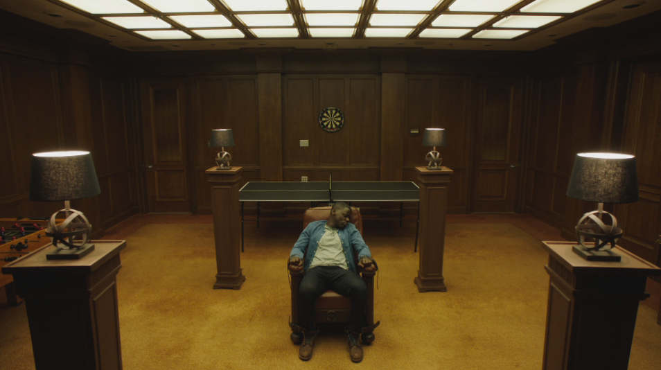 Daniel Kaluuya in 2017 film GET OUT strapped in recliner chair.
