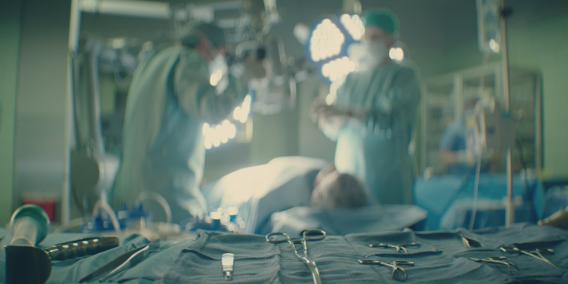 Doctors in the 2019 documentary series LORENA standing over surgery patient.