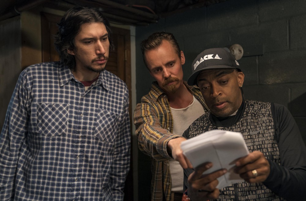 Adam Driver, Jasper Paakkonen, and Spike Lee on the set of the 2018 film BLACKKKLANSMAN looking at sides.